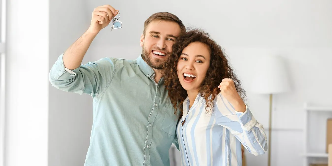 Happy couple receiving keys to new home in Switzerland | Seamless home relocation
